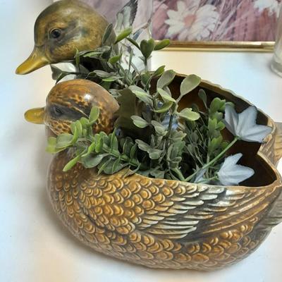 Country famed art work and duck decor.