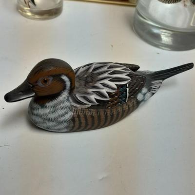 Country famed art work and duck decor.