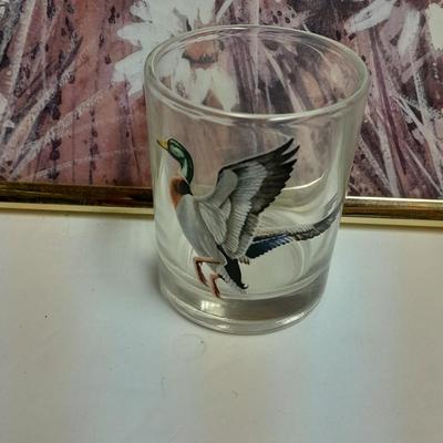 Country famed art work and duck decor.