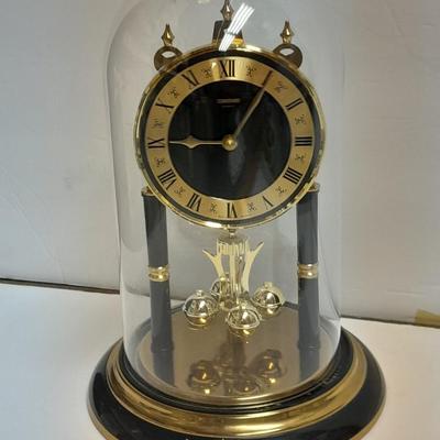 Condor Quartz anniversary clock with glass dome and small little boy blue figure