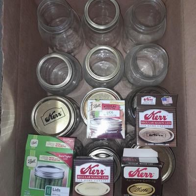 14+ glass canning jars with an assortment of lids