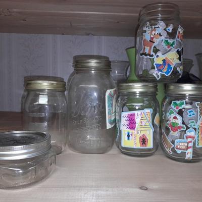 14+ glass canning jars with an assortment of lids