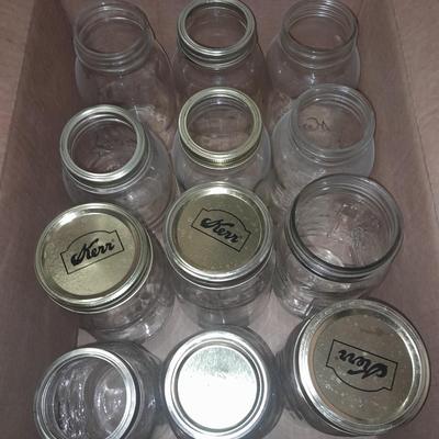 14+ glass canning jars with an assortment of lids