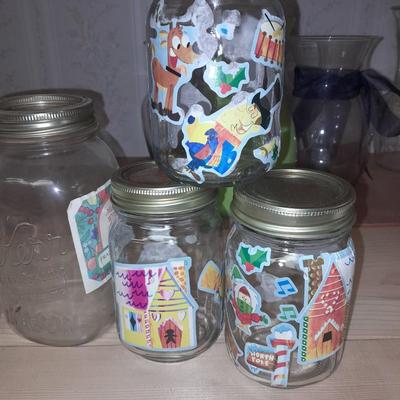 14+ glass canning jars with an assortment of lids