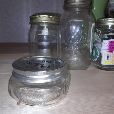 14+ glass canning jars with an assortment of lids
