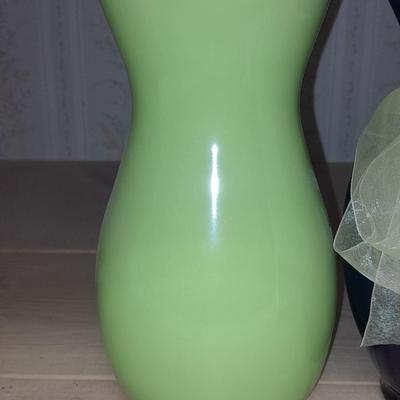 Two glass vases, one green, one blue