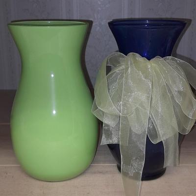 Two glass vases, one green, one blue