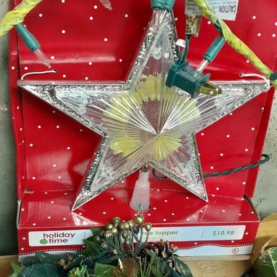 Large light up Christmas star, tree topper, and tinsel Garland