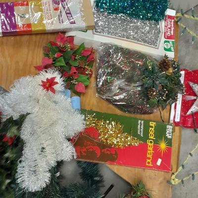 Large light up Christmas star, tree topper, and tinsel Garland