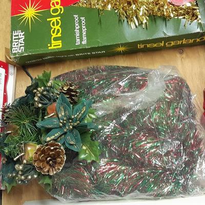 Large light up Christmas star, tree topper, and tinsel Garland