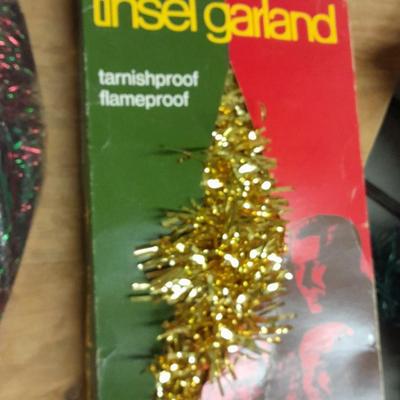 Large light up Christmas star, tree topper, and tinsel Garland