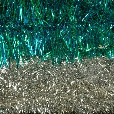 Large light up Christmas star, tree topper, and tinsel Garland