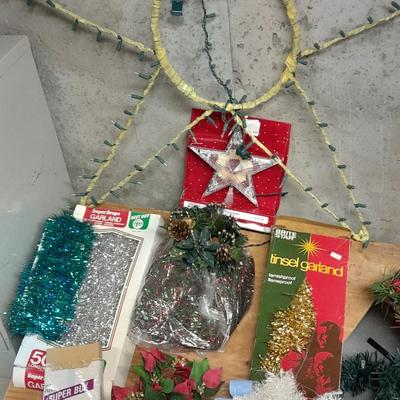 Large light up Christmas star, tree topper, and tinsel Garland