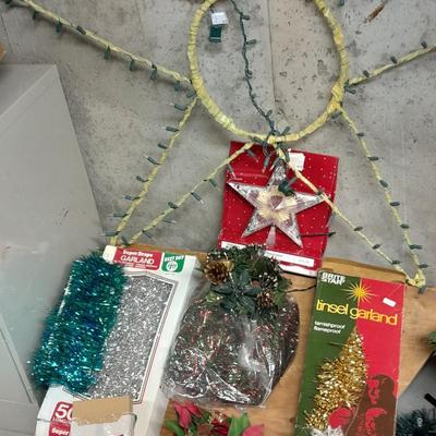 Large light up Christmas star, tree topper, and tinsel Garland