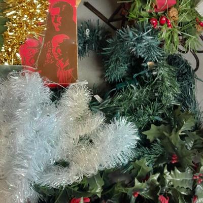 Large light up Christmas star, tree topper, and tinsel Garland