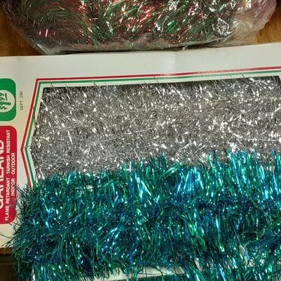 Large light up Christmas star, tree topper, and tinsel Garland