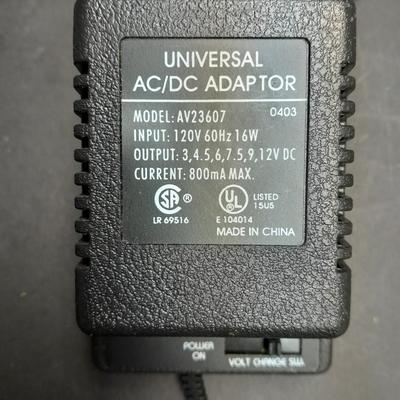 Vintage handheld Realistic CB radio with case and a multi-plug power supply TRC-208 5 watt 6 channel