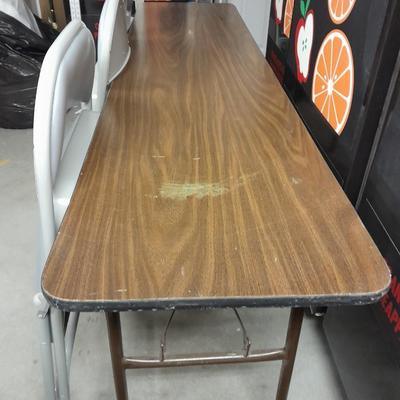 Six foot Long narrow folding buffet table with 4 metal chairs with cushions