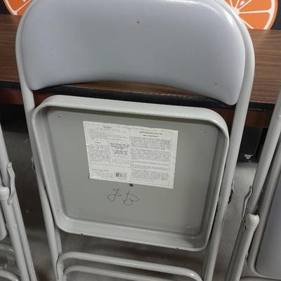 Six foot Long narrow folding buffet table with 4 metal chairs with cushions