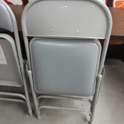 Six foot Long narrow folding buffet table with 4 metal chairs with cushions