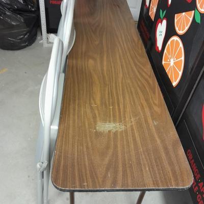Six foot Long narrow folding buffet table with 4 metal chairs with cushions