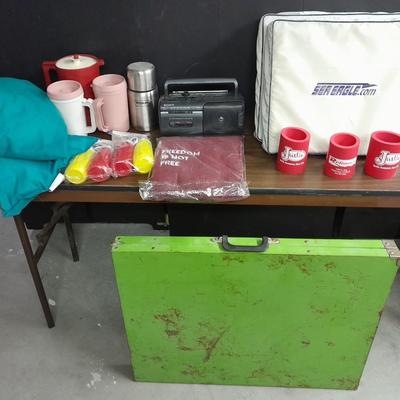 Metal folding camping table with camping supplies