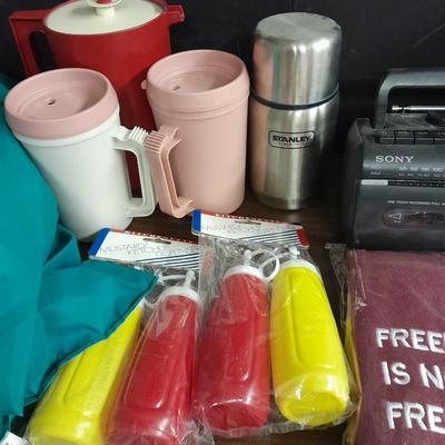 Metal folding camping table with camping supplies