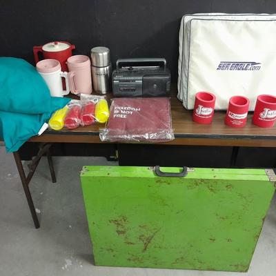 Metal folding camping table with camping supplies