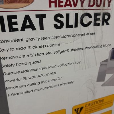 Heavy Duty Cabela's meat slicer                                   basement