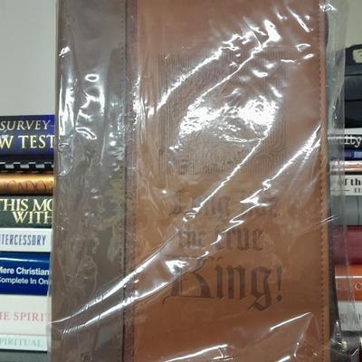 Hard back and soft back books with a new bible cover