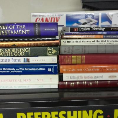 Hard back and soft back books with a new bible cover