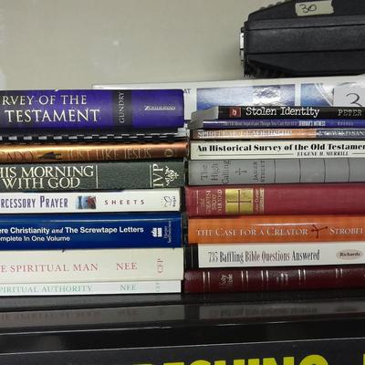 Hard back and soft back books with a new bible cover