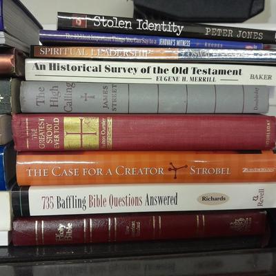 Hard back and soft back books with a new bible cover