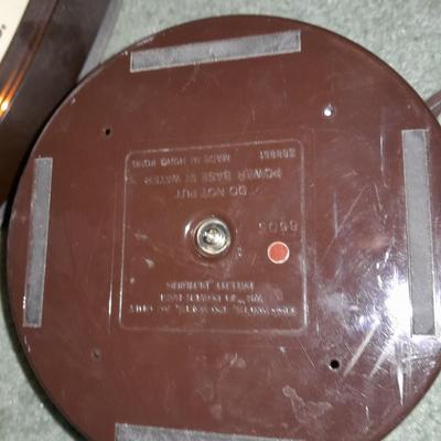 Ironing board with a Westbend power ease cordless Iron and power base charger