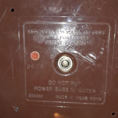 Ironing board with a Westbend power ease cordless Iron and power base charger