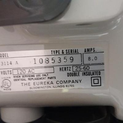 Eureka Mighty Mite canister Vacuum with attachment and extra bags and a cleaning bucket