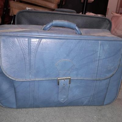 Two vintage suitcases and a leather like Garment bag Skyway & American tourist