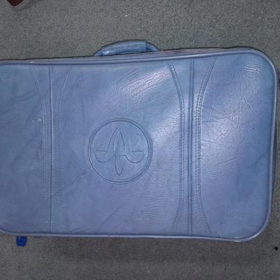 Two vintage suitcases and a leather like Garment bag Skyway & American tourist