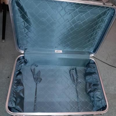 Two vintage suitcases and a leather like Garment bag Skyway & American tourist