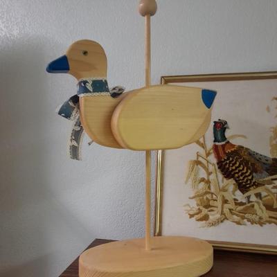 TV cabinet with Cross stitch Pheasent picture, wooden goose and candle sconce