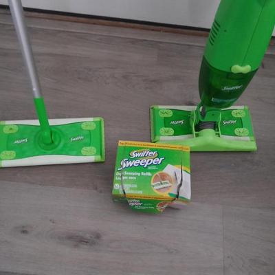 Two Swiffer mops and Swiffer pads