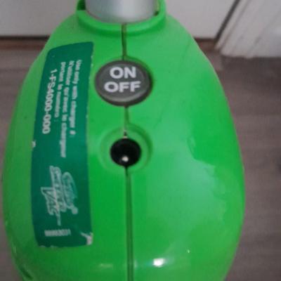 Two Swiffer mops and Swiffer pads