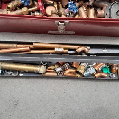 Red PROTO toolbox with plumbing connections, copper and brass