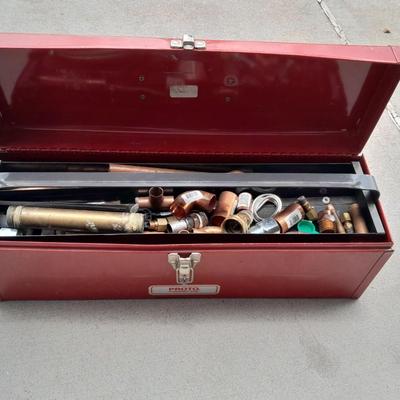 Red PROTO toolbox with plumbing connections, copper and brass