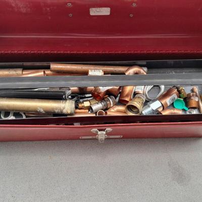 Red PROTO toolbox with plumbing connections, copper and brass