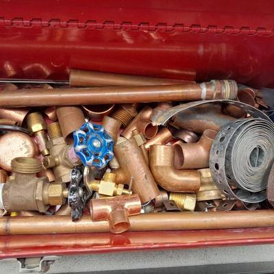 Red PROTO toolbox with plumbing connections, copper and brass