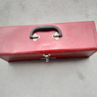 Red PROTO toolbox with plumbing connections, copper and brass