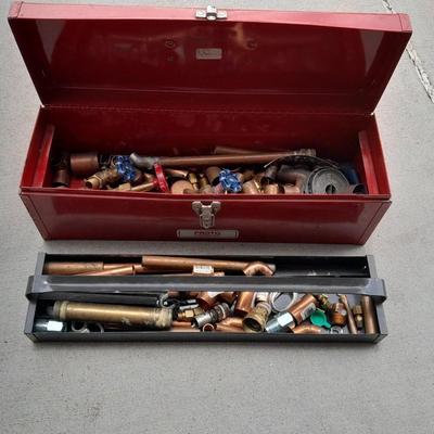 Red PROTO toolbox with plumbing connections, copper and brass