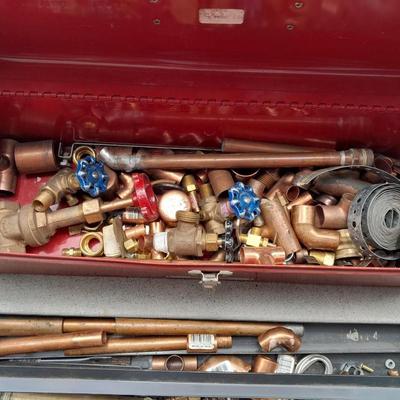 Red PROTO toolbox with plumbing connections, copper and brass