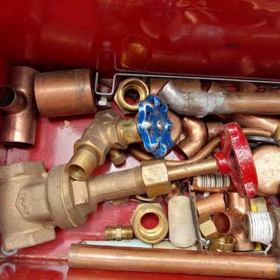 Red PROTO toolbox with plumbing connections, copper and brass